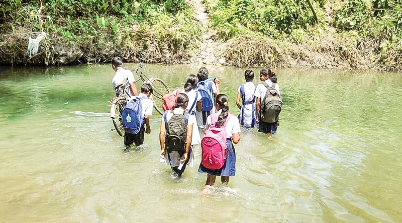 Alipurduar: No bridge, students cross river daily for school 
