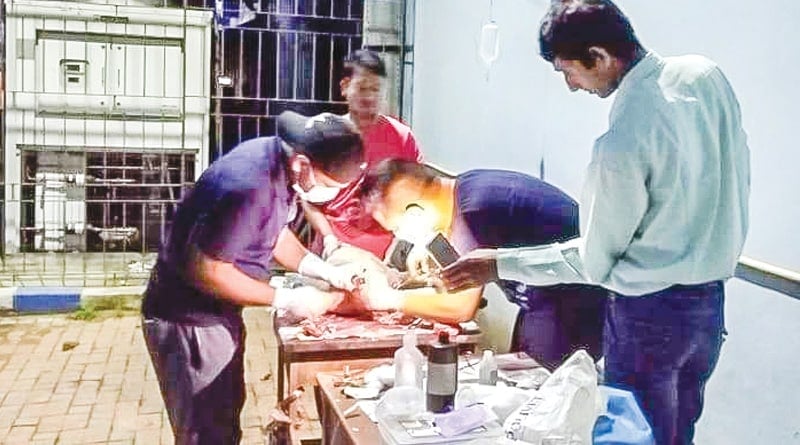 Vets operates on Dog under mobile Phone torch 