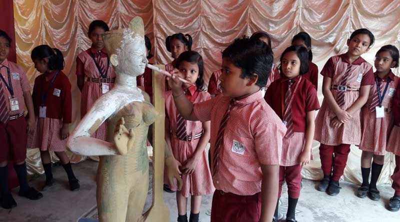 Kid makes Saraswati idol for school