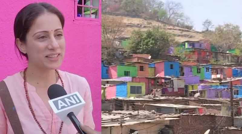 Artist painting Pune slums