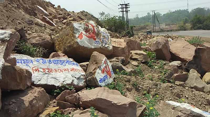 To lack of wall, CPIM printed graffiti in stone at Jamuria