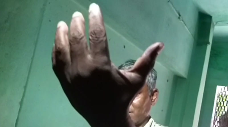 Man casts vote on behalf of his mother in a booth at Balagarh in Hooghly