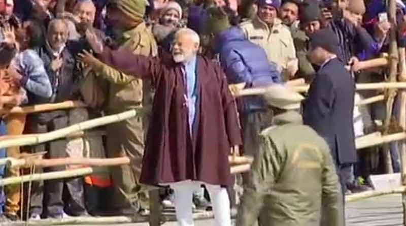 Prime Minister Narendra Modi greets devotees at Kedarnath temple.