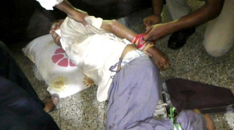 A man beaten up by his son in Durgapur's kaksha area.