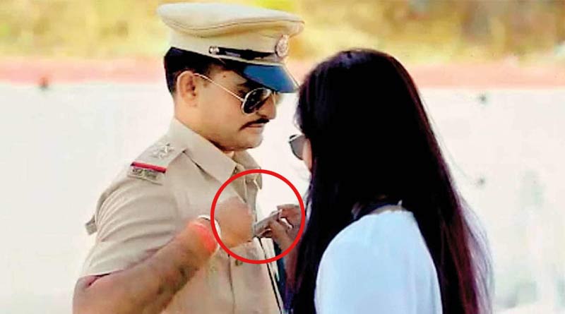 Police officer caught on camera ‘accepting bribe’ from his fiancée