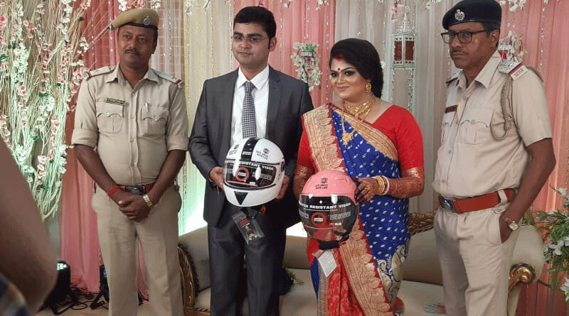 Police presents two Helmet to a newly wed couple in Suri