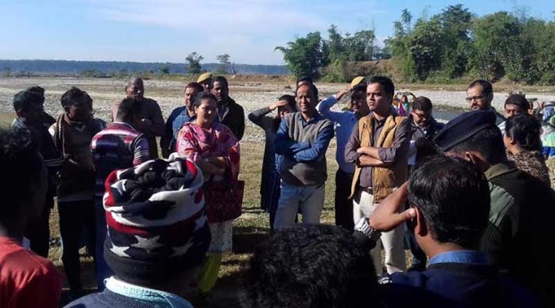 Jalpaiguri district magistrate Abhishek Tiwari approaches people