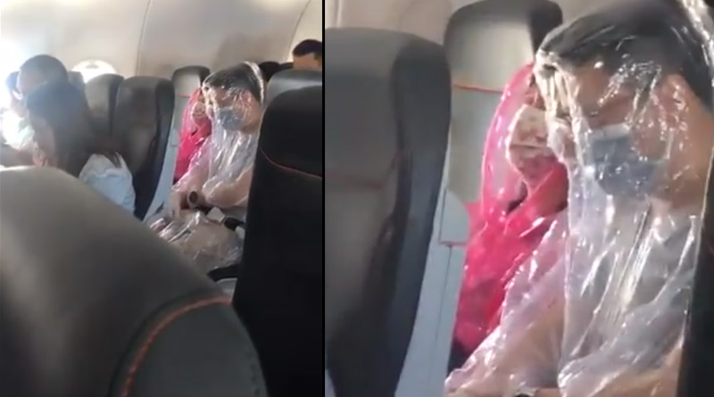 Coronavirus: Passengers on flight wrap themselves in plastic