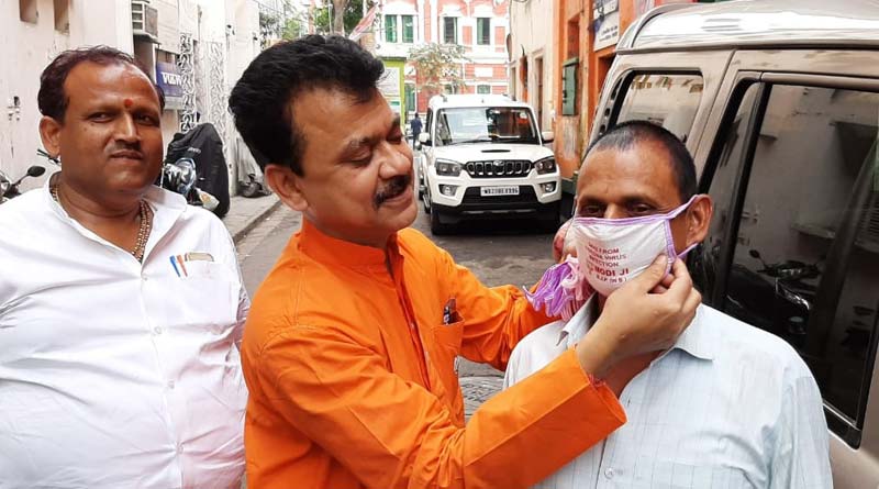 Coronavirus Scare: Bengal BJP Leader distributes Modi Mask