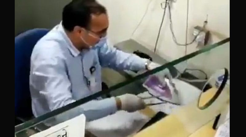 Gujarat banker uses steam iron to disinfect cheque