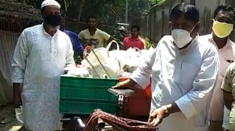 MLA Haji Nurul Islam feeds some people of Haroa on wednesday