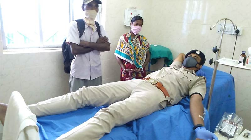 A police officer donates blood for a thalassemia patient