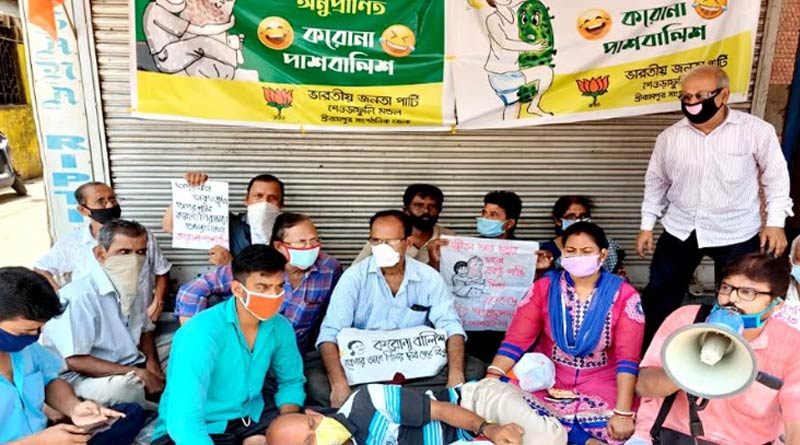 BJP workers stage protest aginst CM's comment over CoronaVirus