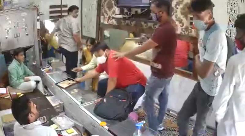 The robbers calmly sanitise hands and then casually rob the store