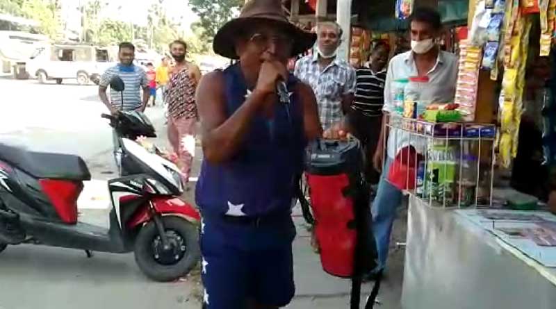 Bengali news: Toto driver keeps aware local people over Corona Virus through his song | Sangbad Pratidin
