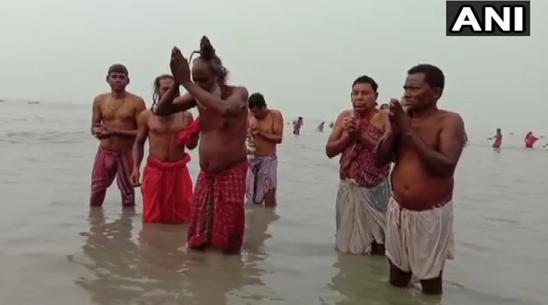 Devotees and hermits take holy dip at Gangasagar ।Sangbad Pratidin