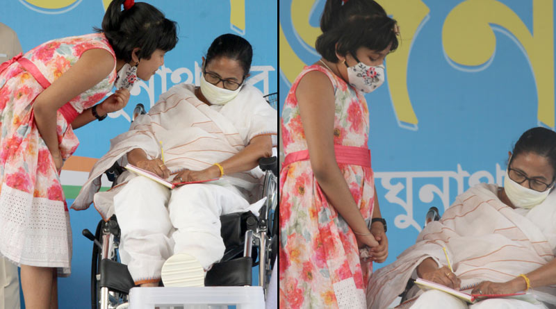 A girl is seen to talk to Mamata Banerjee at Raghunathpur's stage, Purulia |Sangbad Pratidin