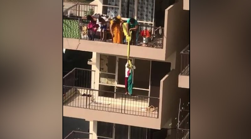 Mother from Faridabad hangs son from 10th floor balcony by bedsheet to fetch saree | Sangbad Pratidin