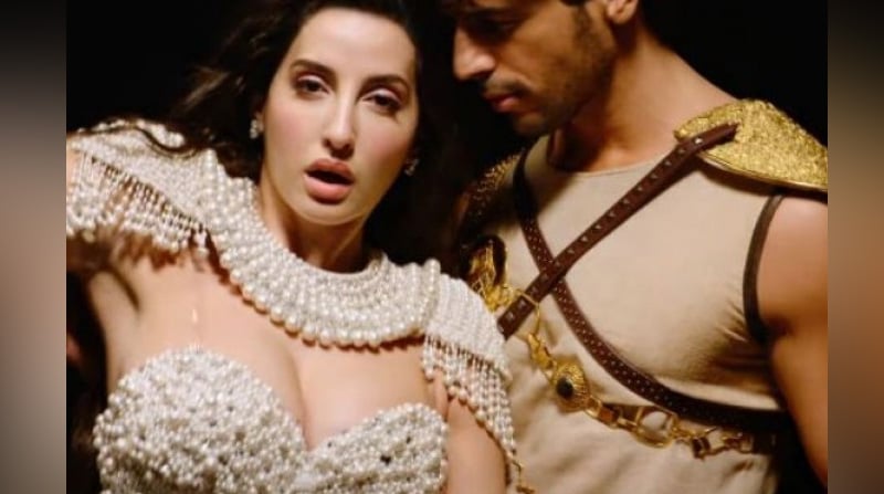 Thank God song Manike Mage Hithe out, Watch Nora Fatehi's seductive dance | Sangbad Pratidin