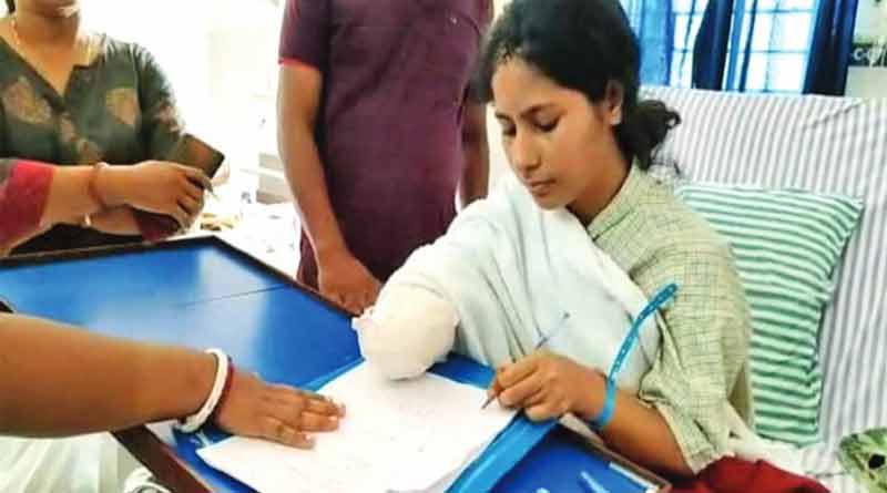 Nurse Renu who lost her hand in domestic violence wrote autobiography with artificial hand | Sangbad Pratidin