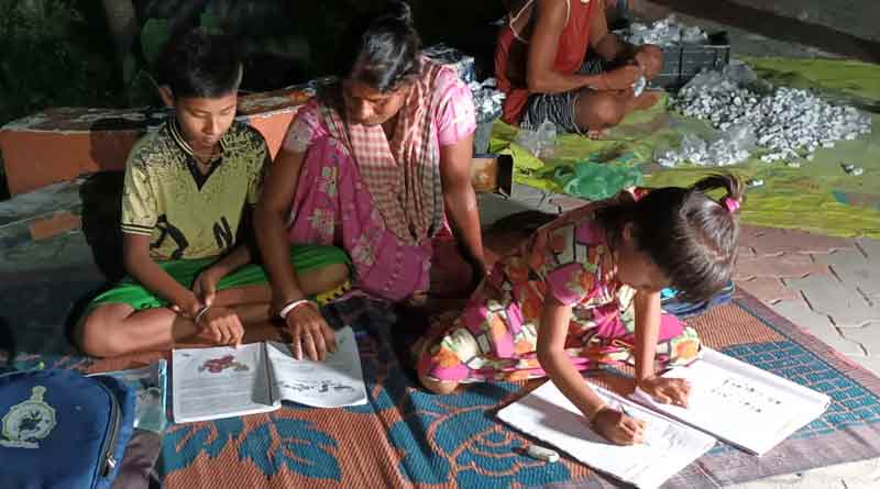 Siblings continue studies in street light in Jalpaiguri