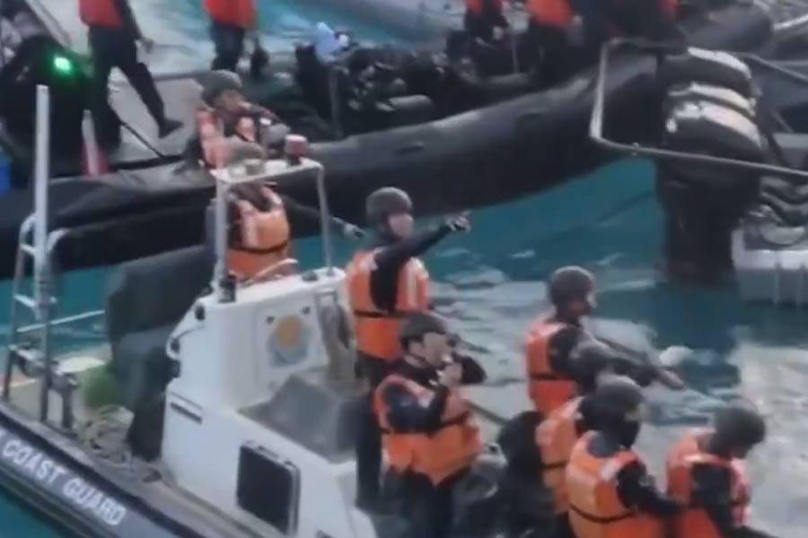 Chinese sailors wield knives, axe in disputed sea clash with Philippines