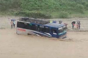 Bus gets stuck in floodwaters in Madarihat