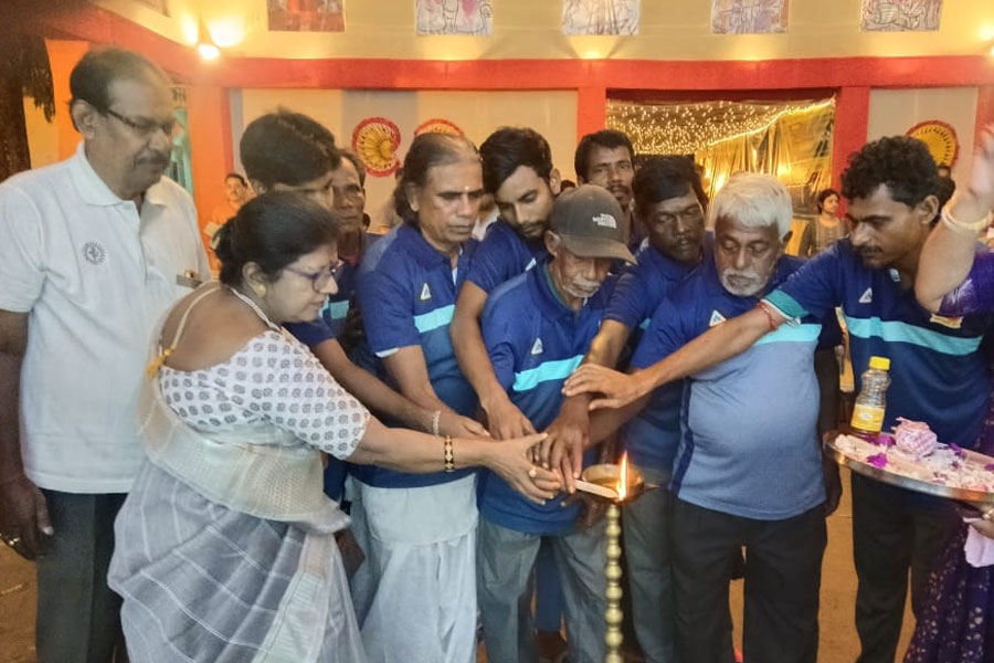Sanitation workers inaugurate the puja of Rajpur's public Durga festival