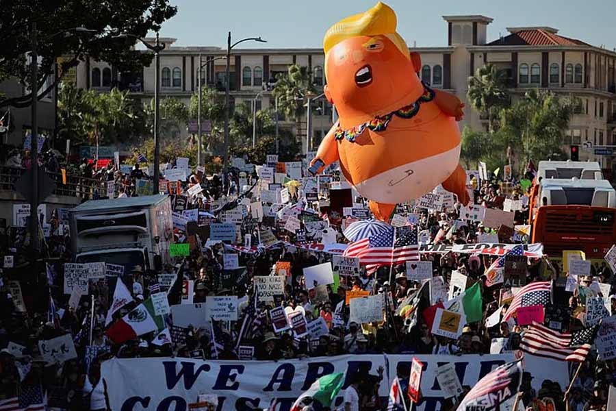 Protesters denounce President Donald Trump